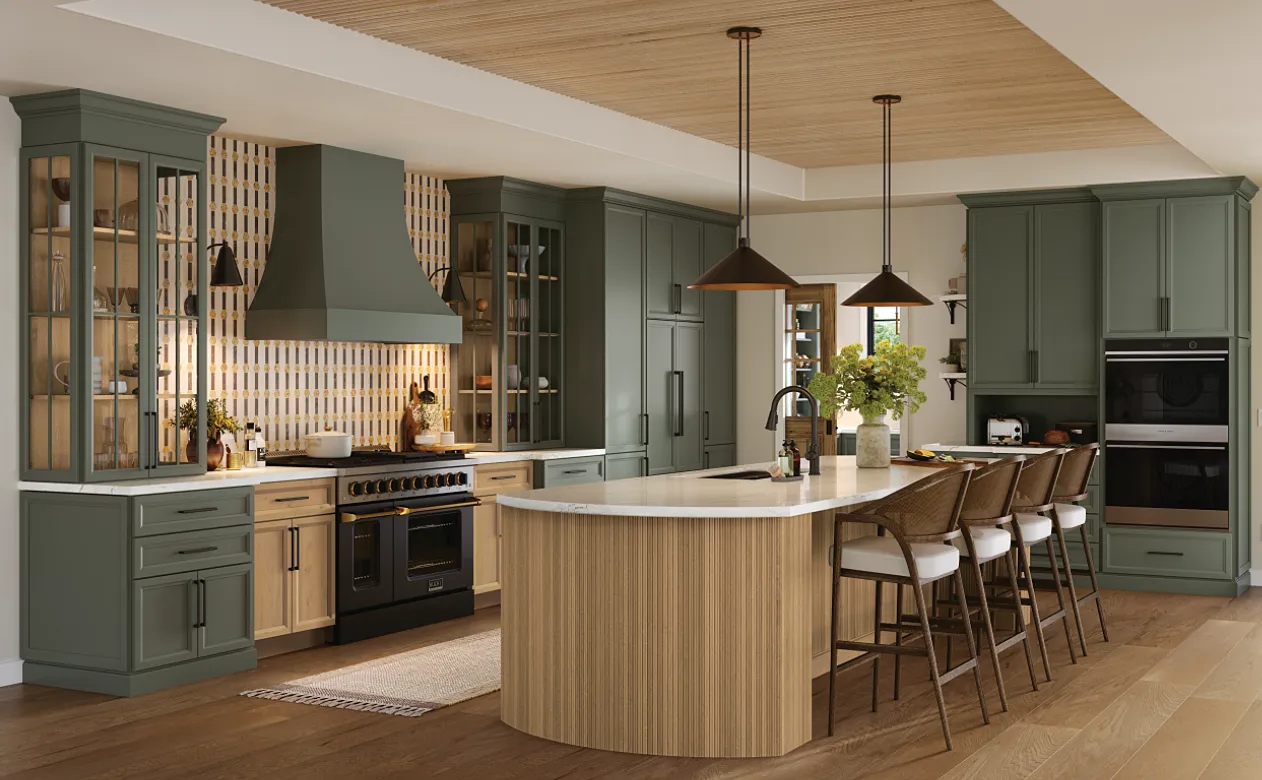 Kitchen with green cabinetry and reeded wood kitchen island