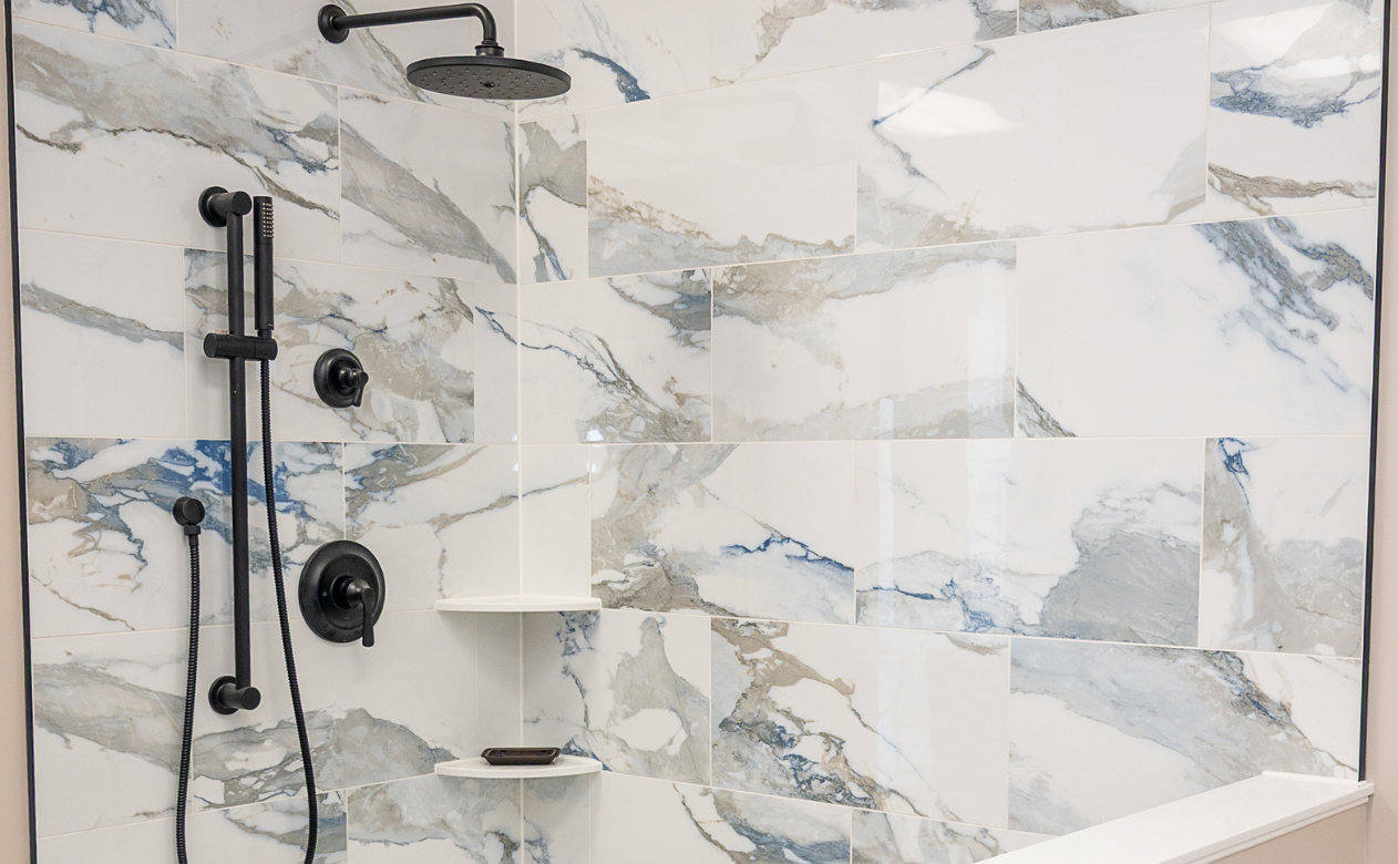 Custom tiled shower and bench and black hardware at MDG Kiba Studios