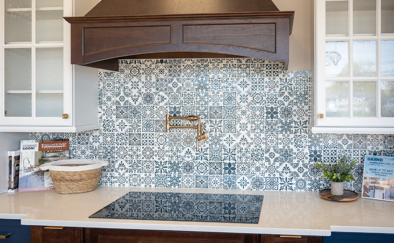 Blue and white tile backsplash in a kitchen display at Kiba Studios in North Olmsted