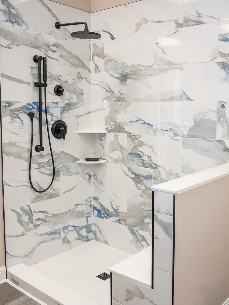 Custom tiled shower and bench and black hardware at MDG Kiba Studios