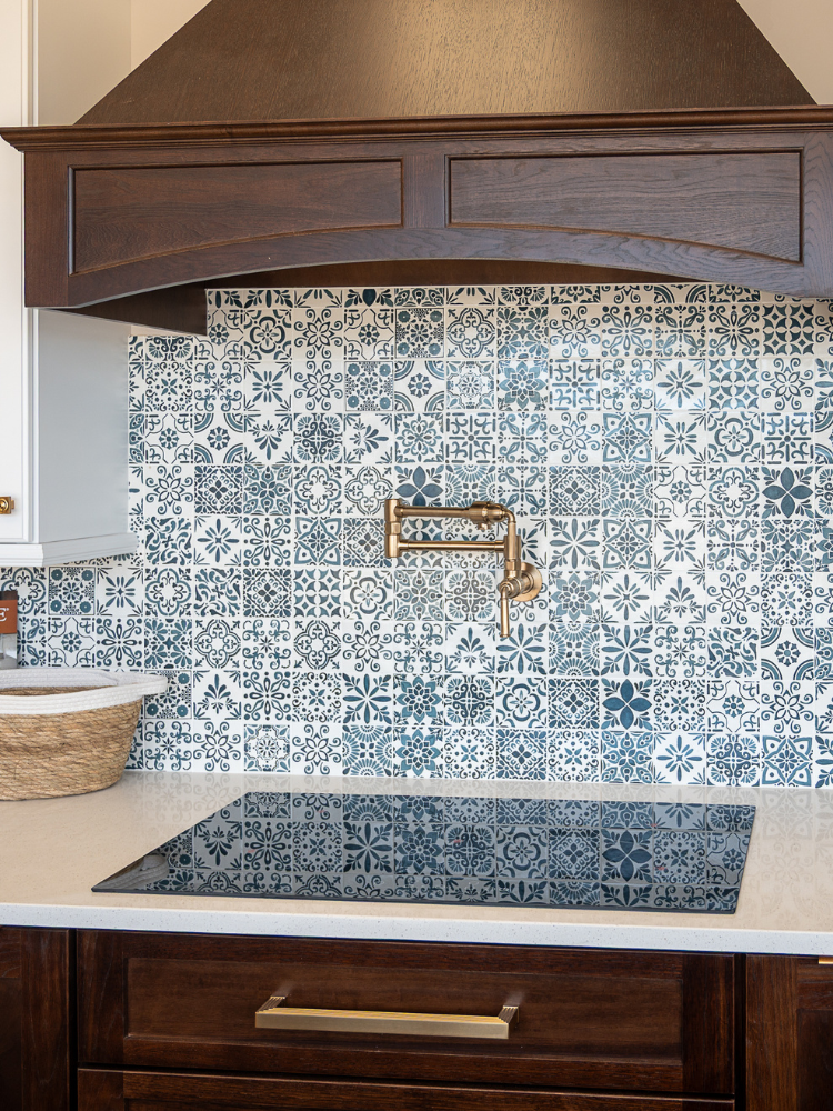 Blue and white tile backsplash in a kitchen display at Kiba Studios in North Olmsted