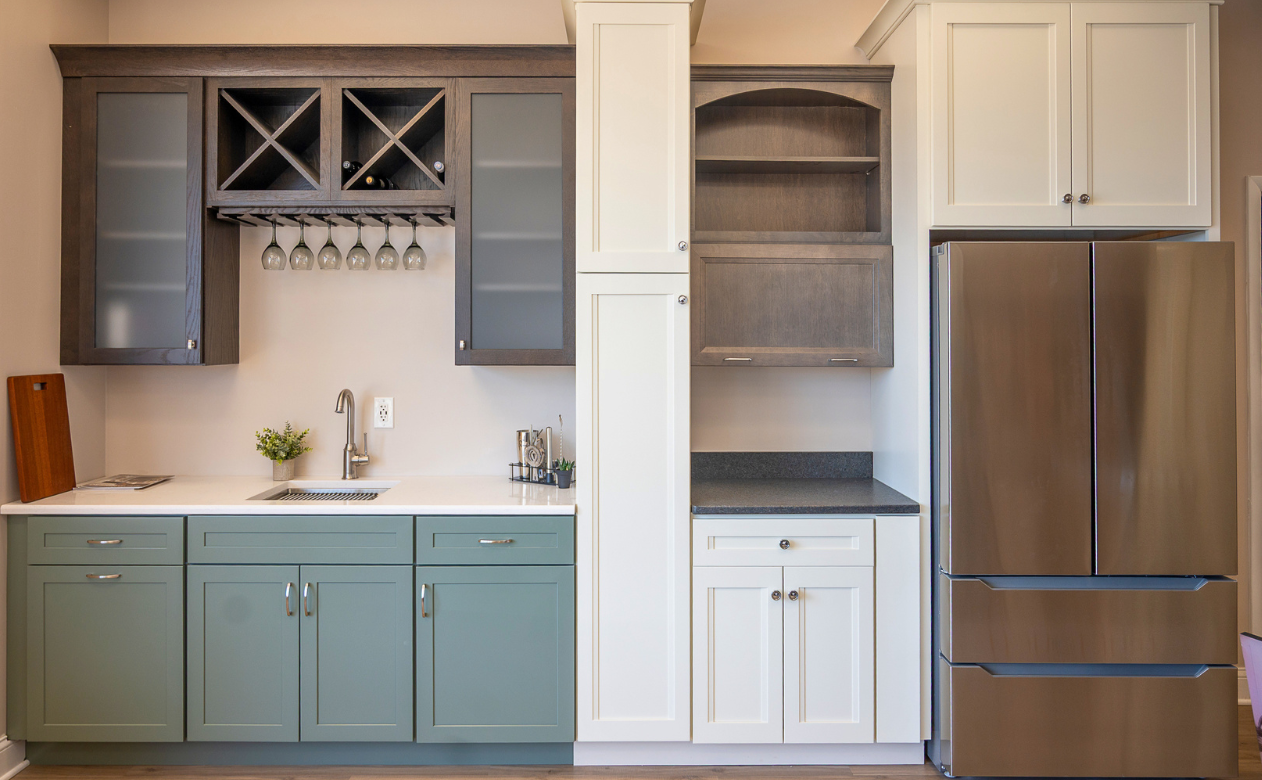 Green and white cabinets in a bar area