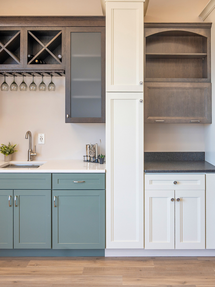 Green and white cabinets in a bar area