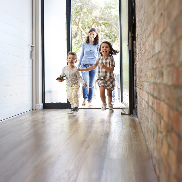 kids running into house with woodlook floors