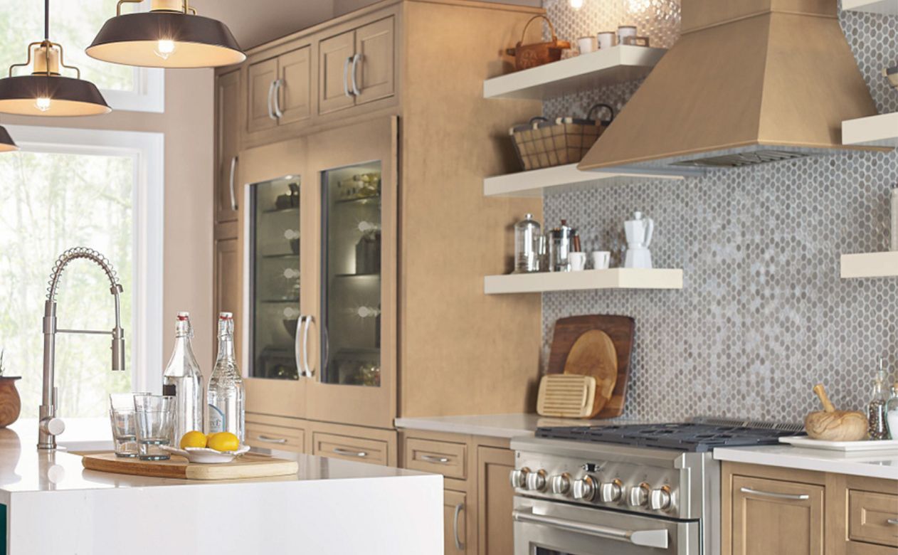 patterned tile kitchen backsplash in a moderrn kitchen with wood cabinets