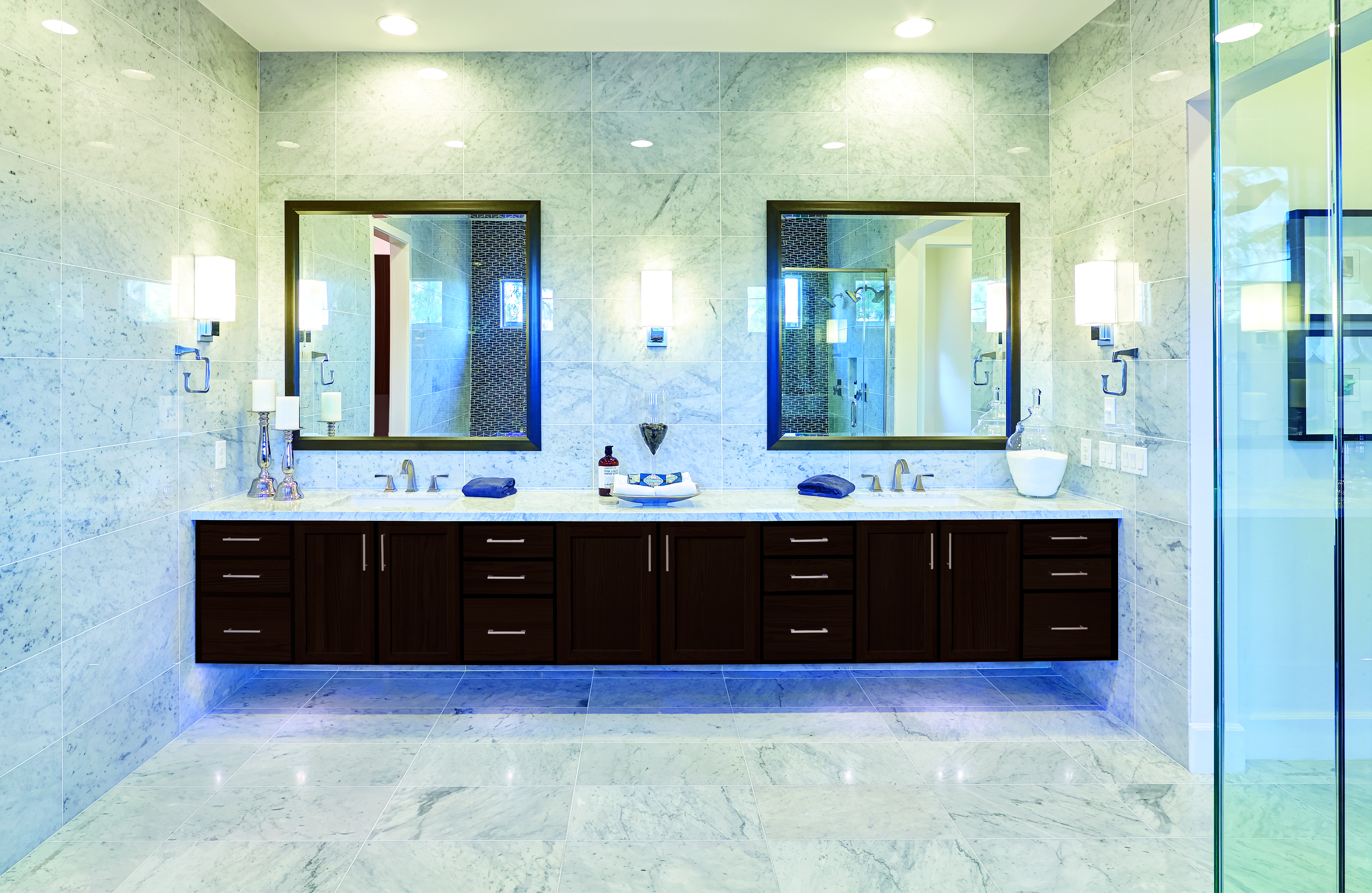 Baxter Oak Espresso Bath Cabinetry with walk-in shower and floor to ceiling marble. 