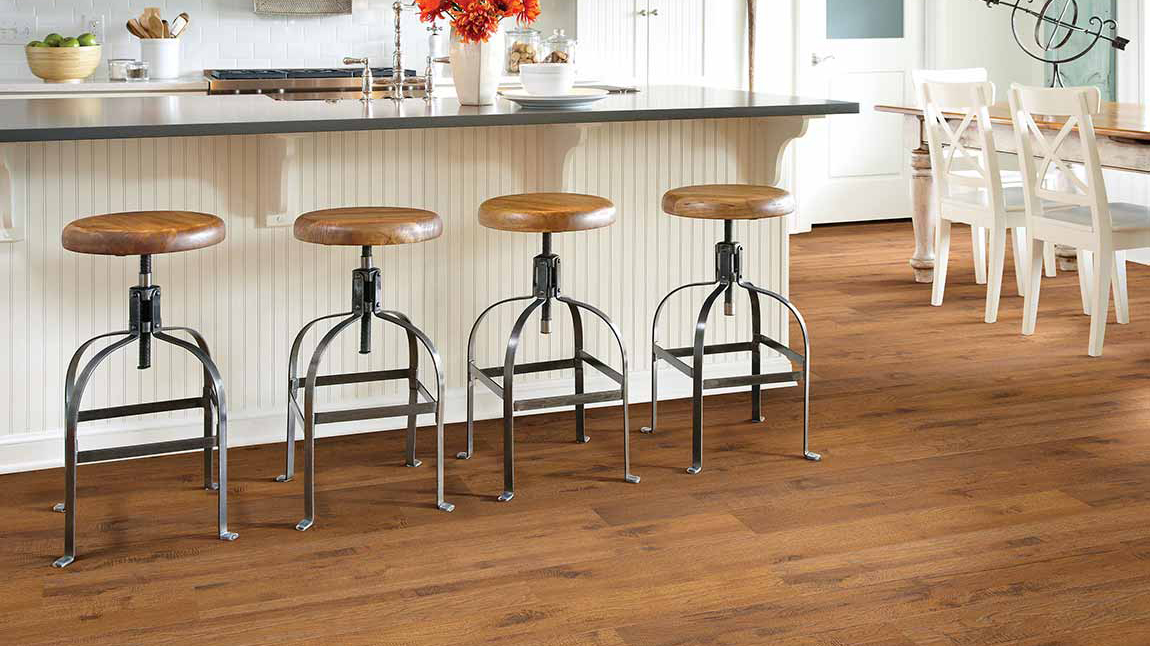 Laminate flooring in a dining area, installation services available.