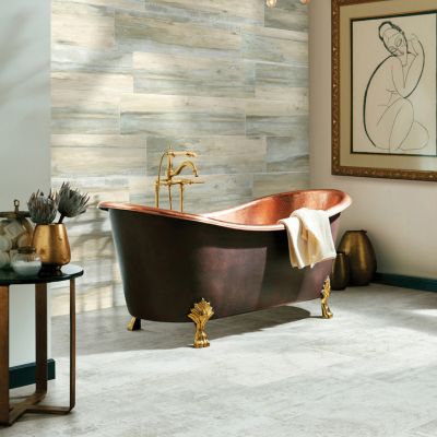 grey tile floors in an elegant North Olmsted bathroom with copper tub