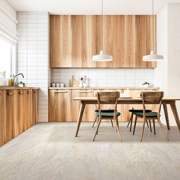 vinyl tile flooring in kitchen with wood cabinets and dining table